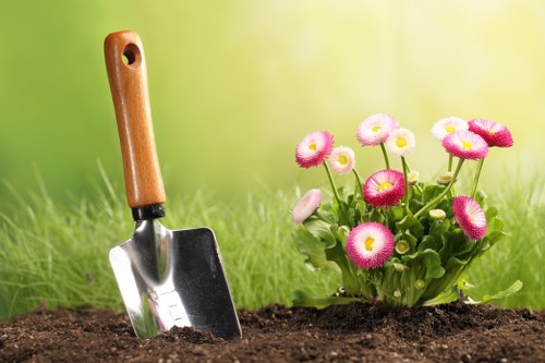 Seasonal garden care in Westcombe Park with shrubs and planted beds